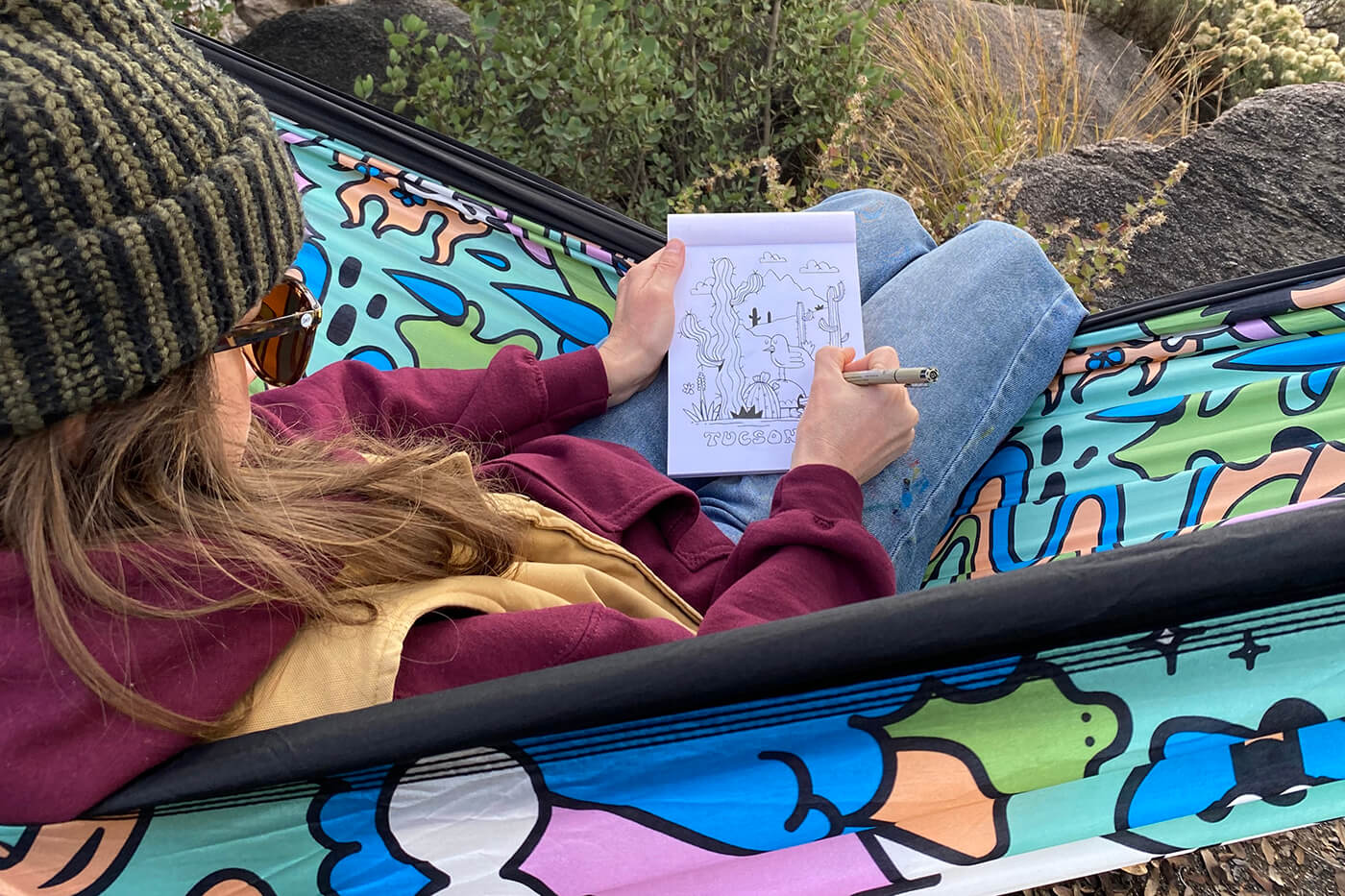 A person doodling in an ENO hammock