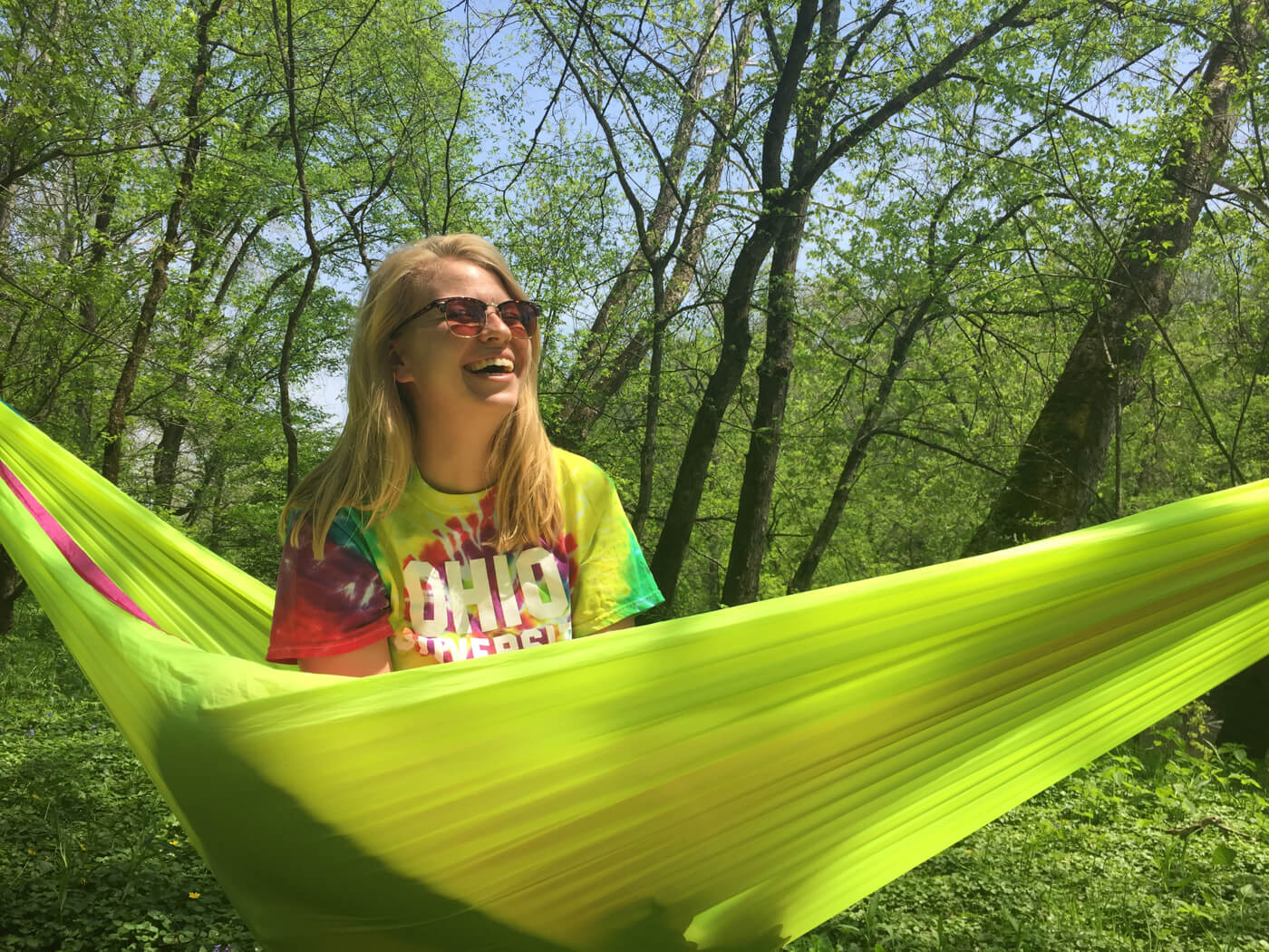 A woman laughing in her ENO Hammock