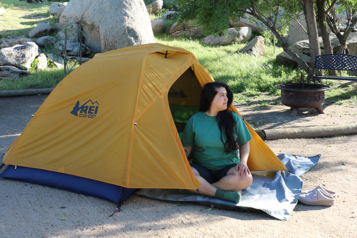 Cindy looking out from her REI tent
