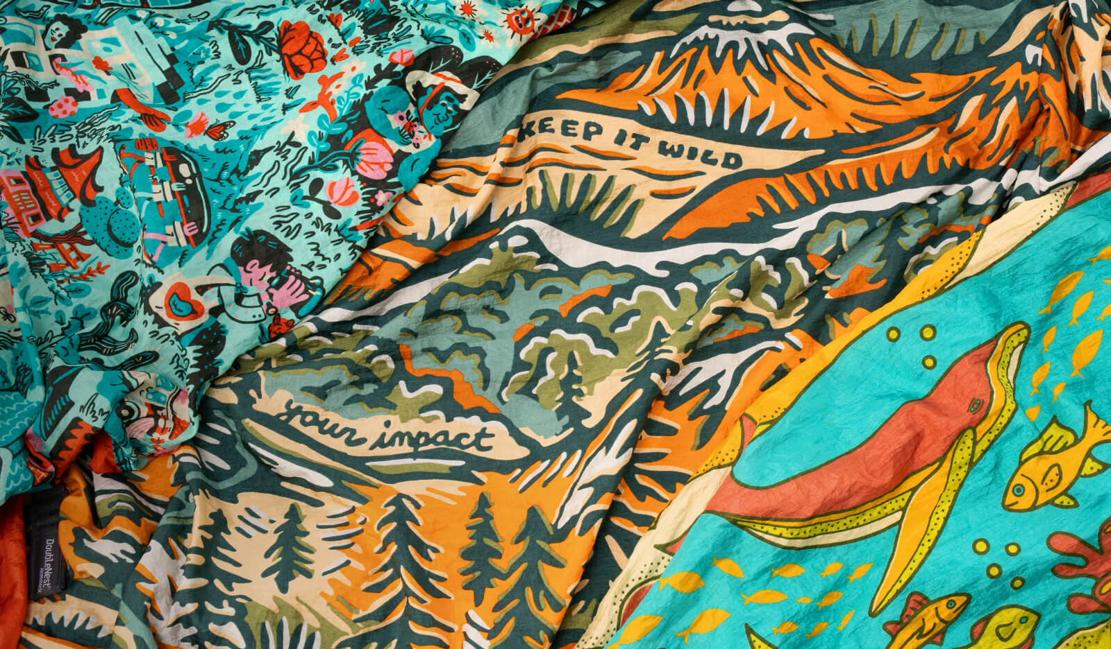 Colorful fabric details of ENO Giving Back Hammocks with nature-themed designs and text