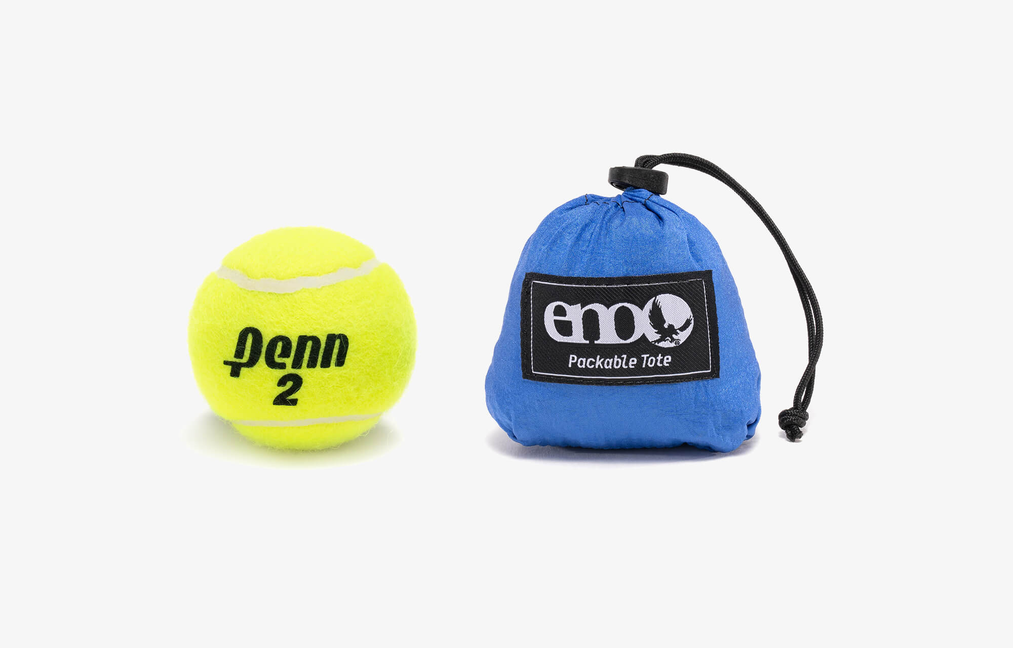 Packed up Packable Tote in its stuff sack compared to tennis ball in size