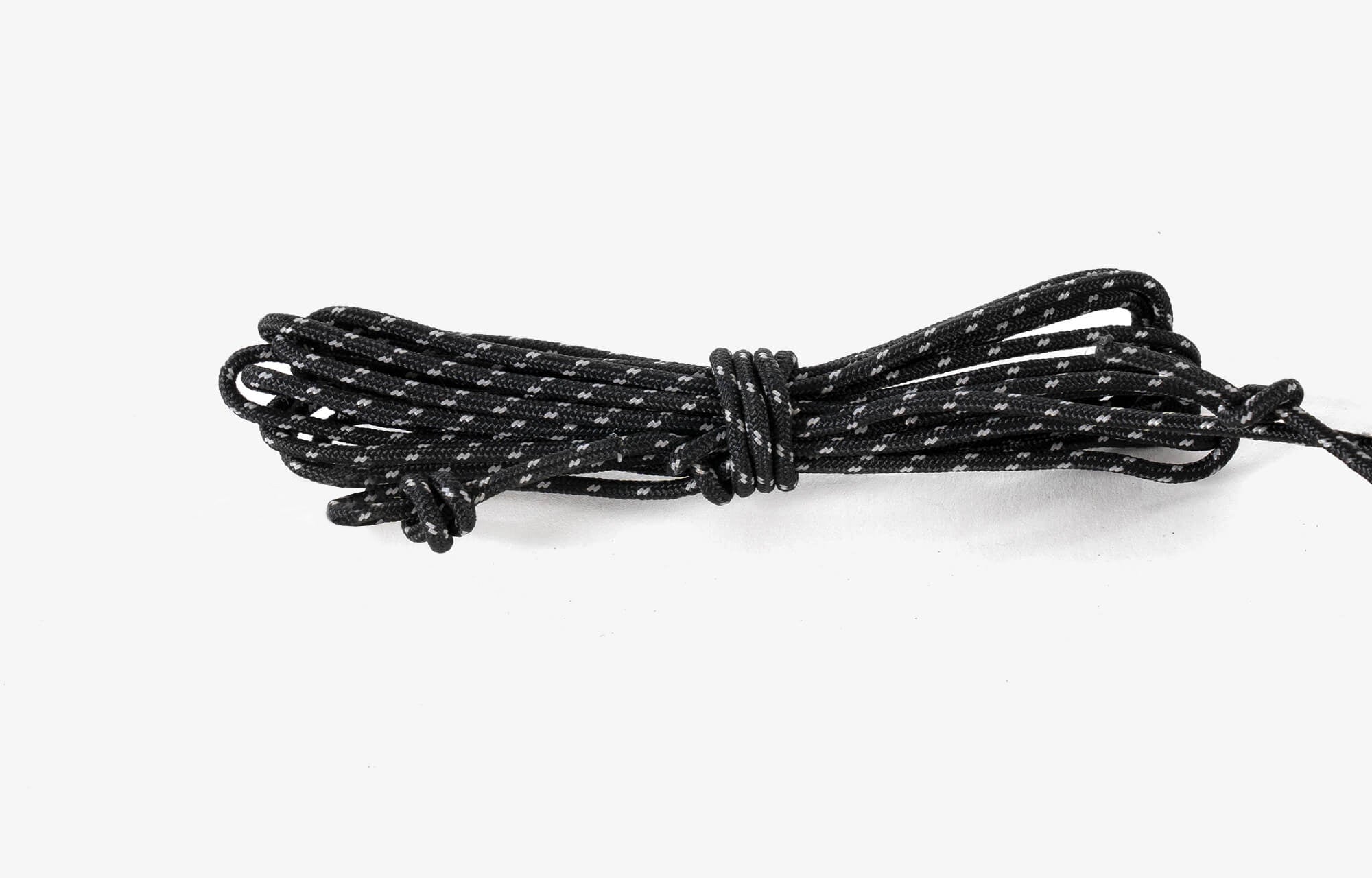 Black and white braided cord on a white background