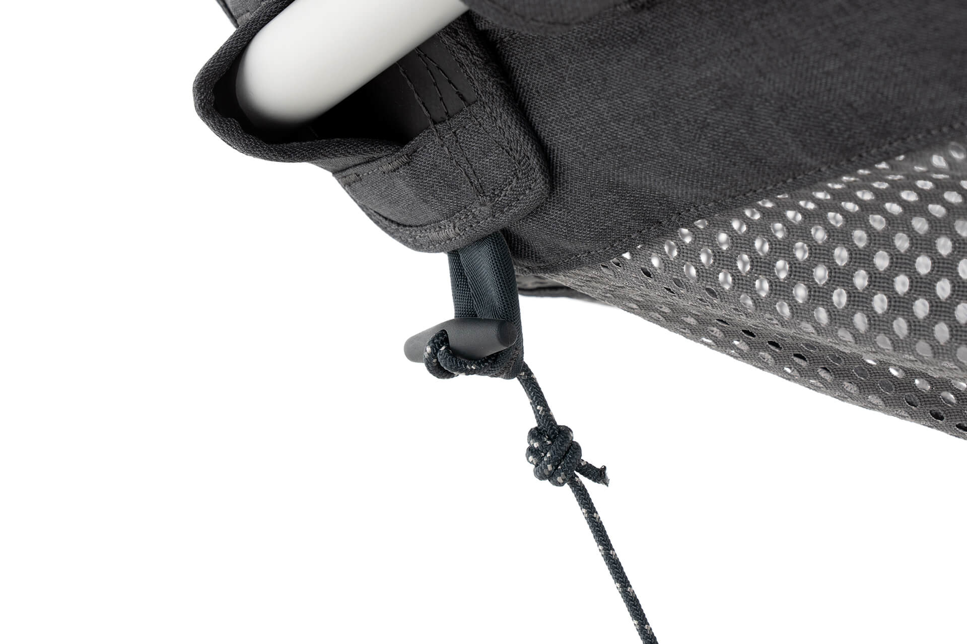 Detail image of the toggle of the ENO Hammock Stand ENO Hammock Stand Tether System's plastic toggle looping through integrated loop of the ENO DayLoft Hammock to provide stability while hammocking.
