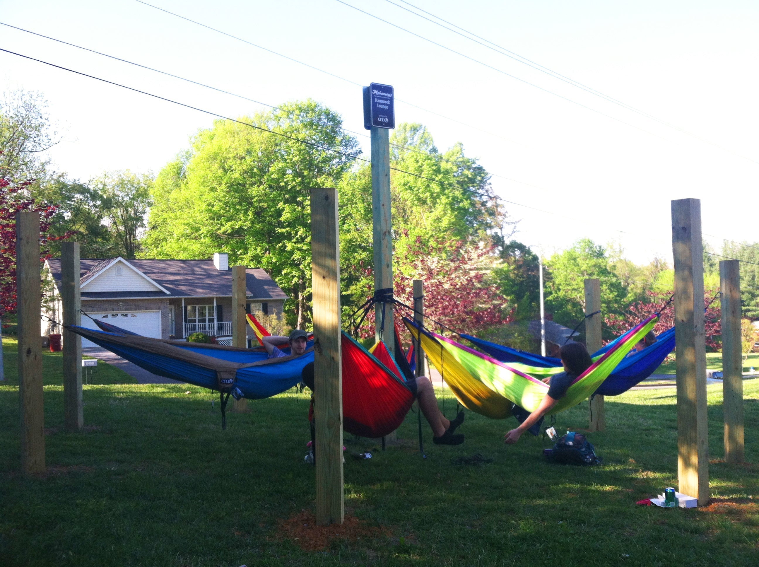 Six people in six different ENO hammocks on various hammocking posts