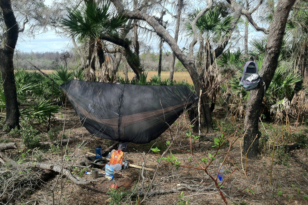 hammock camping in the woods on a backpacking trip