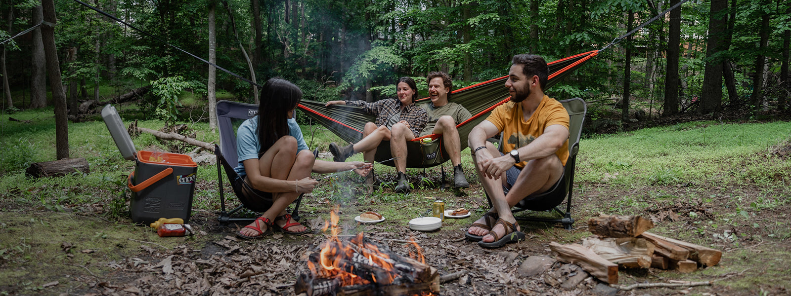 Group of campers enjoying ENO DoubleNest Hammock and Lounger Chairs