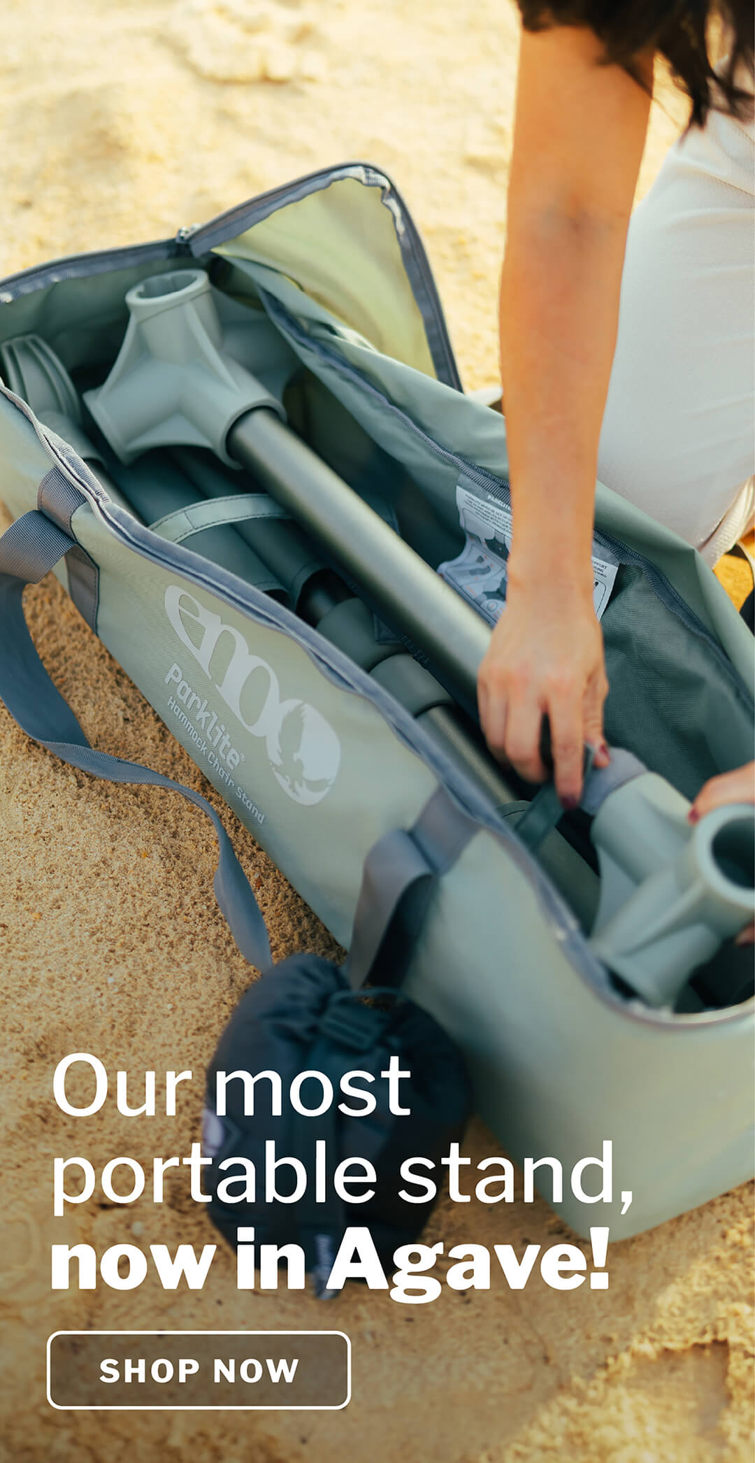 ENO Parklite Hammock Chair Stand in Agave being unpacked from carry case on a sandy background