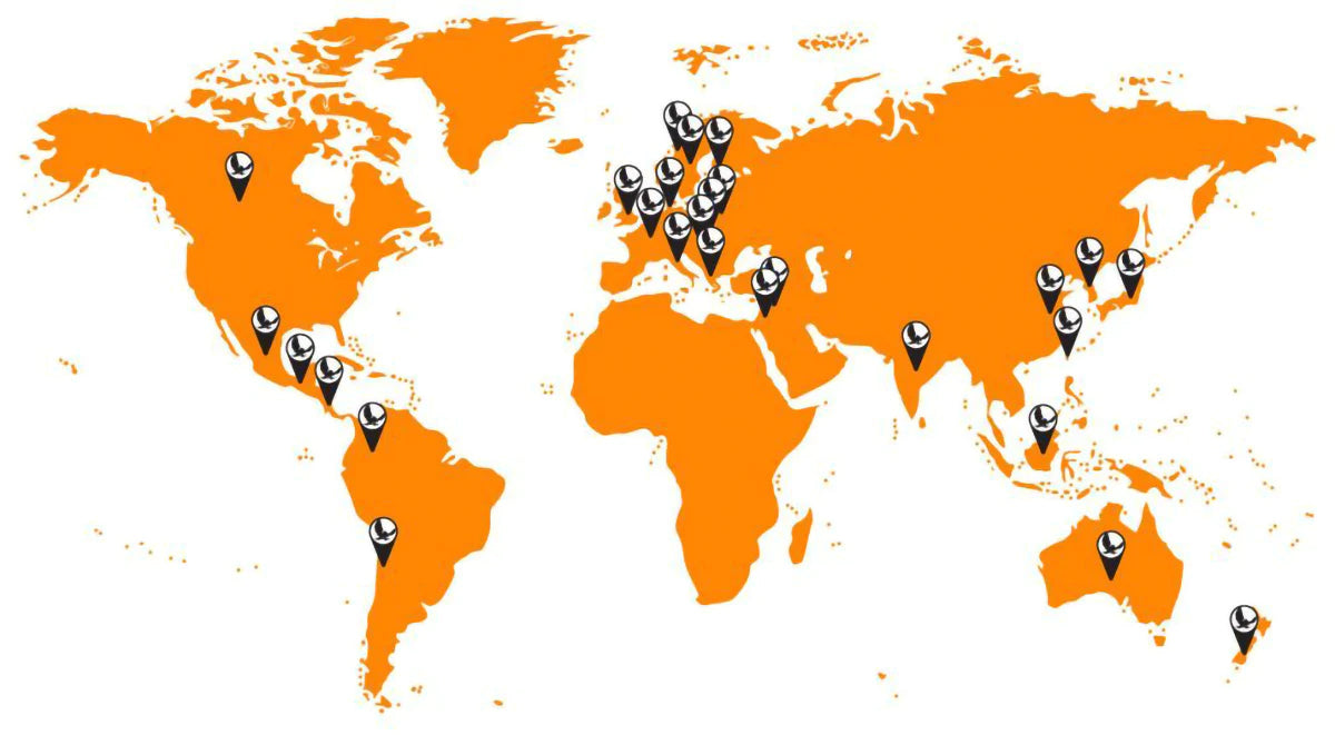 An orange colored world map has purple flags on countries where ENO has International Distributors. 