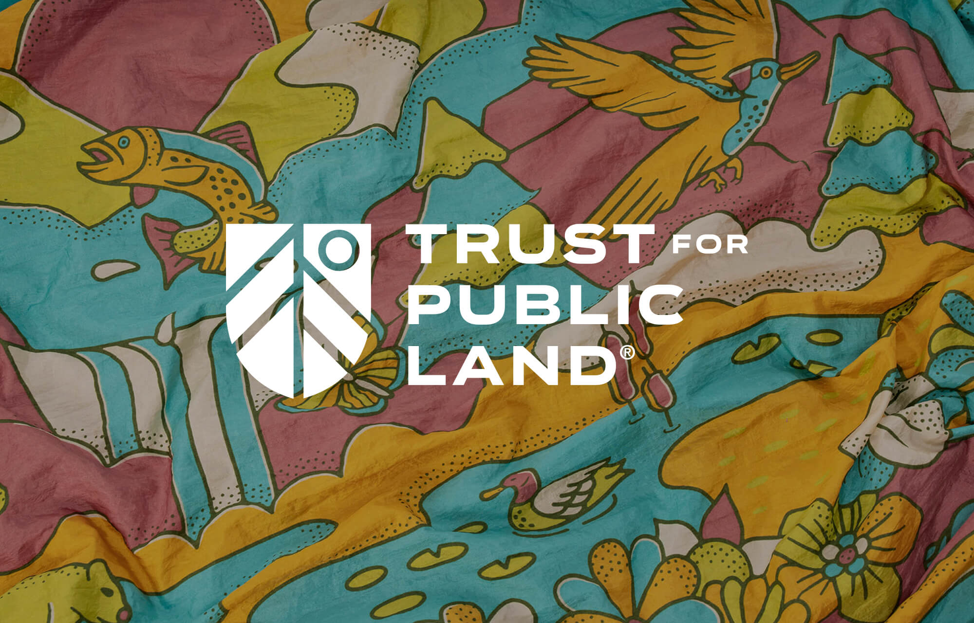 Colorful fabric with animal designs and Trust for Public Land logo overlay