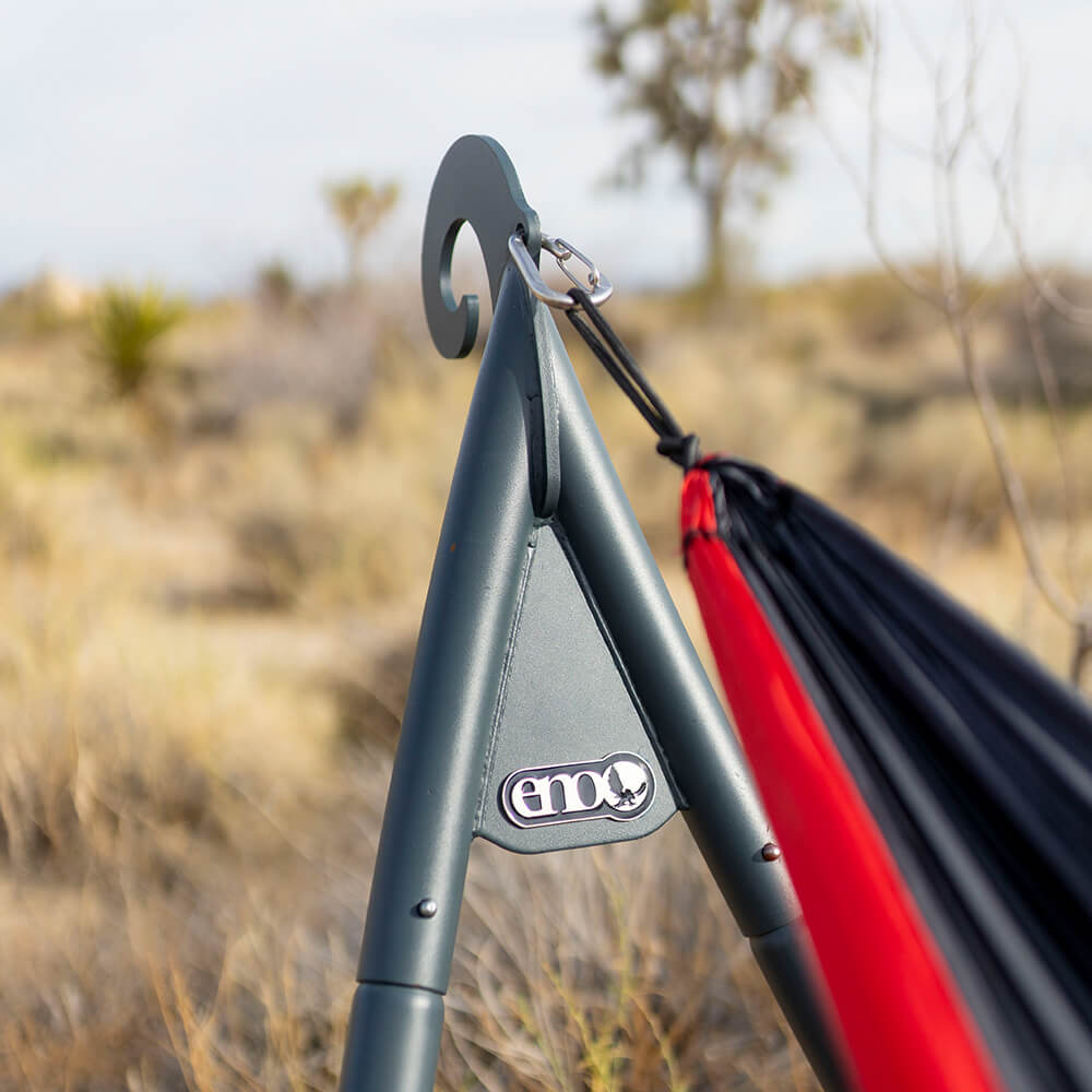 Close-up detail of durable ENO hammock stands with steel hammock carabiner in a desert landscape. 