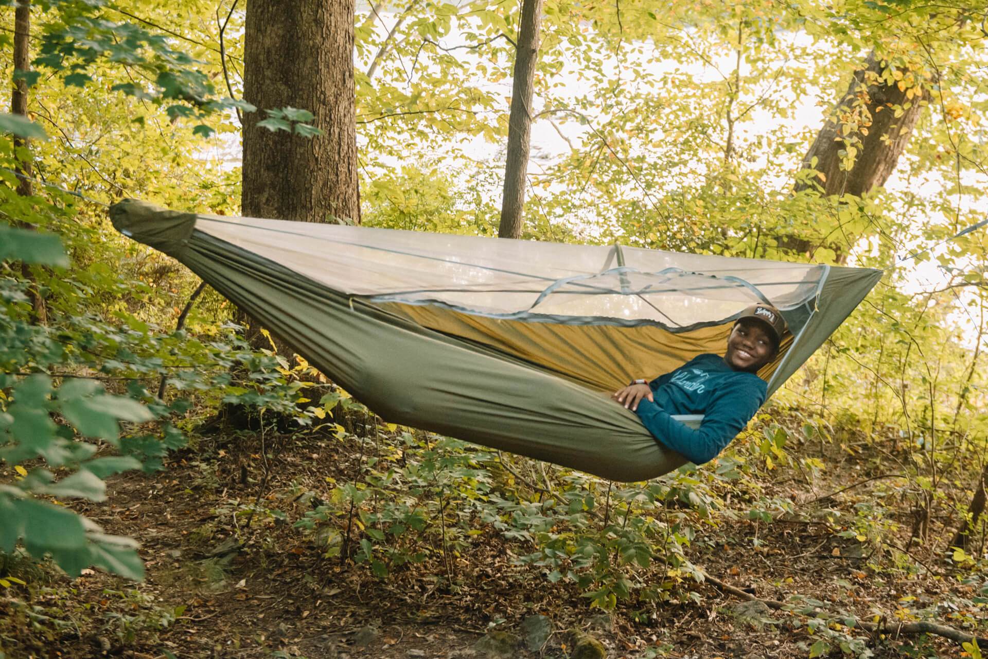 Personr Laying in ENO JungleNest™ Hammock in Woods